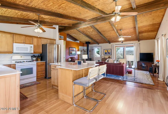 Flowing open floor plan connects kitchen and living room. Comfortable desert living in Hackberry AZ near Route 66.