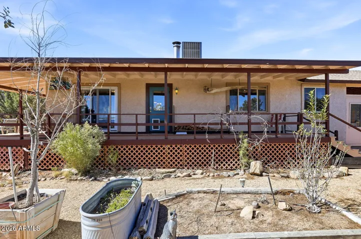 Spacious front porch overlooking the desert garden at this Hackberry AZ home near Kingman. Relax and enjoy peaceful Mojave County views.