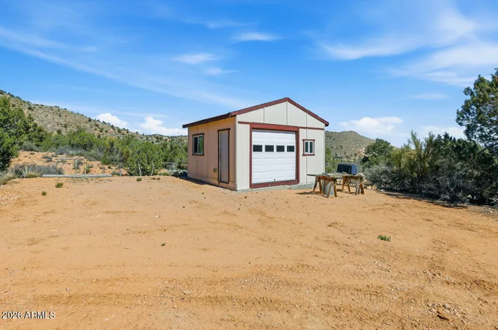 Detached workshop and storage building at this Hackberry AZ property near Kingman surrounded by Mojave County desert views.