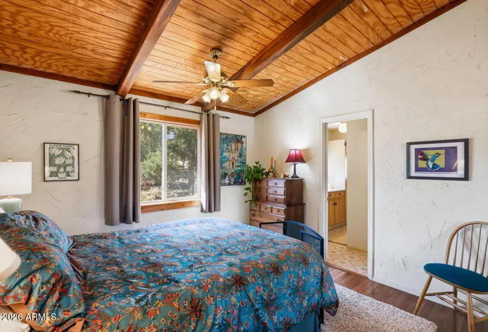 Primary bedroom with natural light and direct access to ensuite bath. Comfortable retreat in Hackberry Arizona.