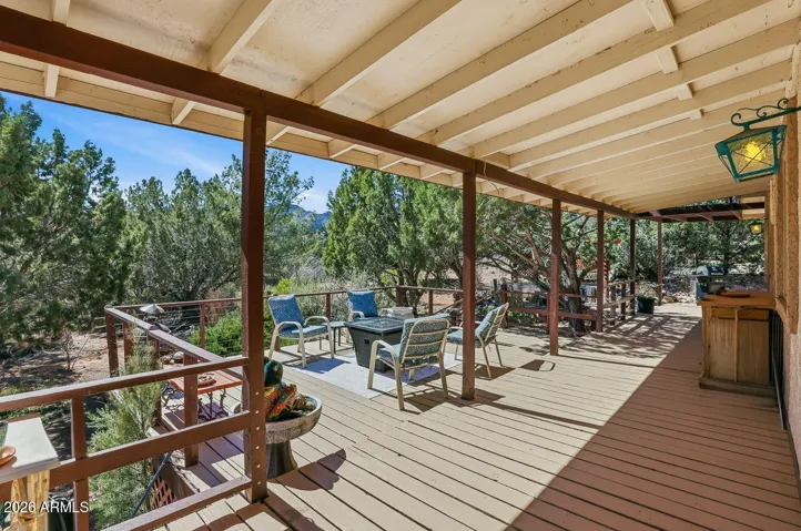 Expansive wraparound deck overlooking Mojave County desert landscape. Ideal outdoor living space in Hackberry AZ near Kingman.