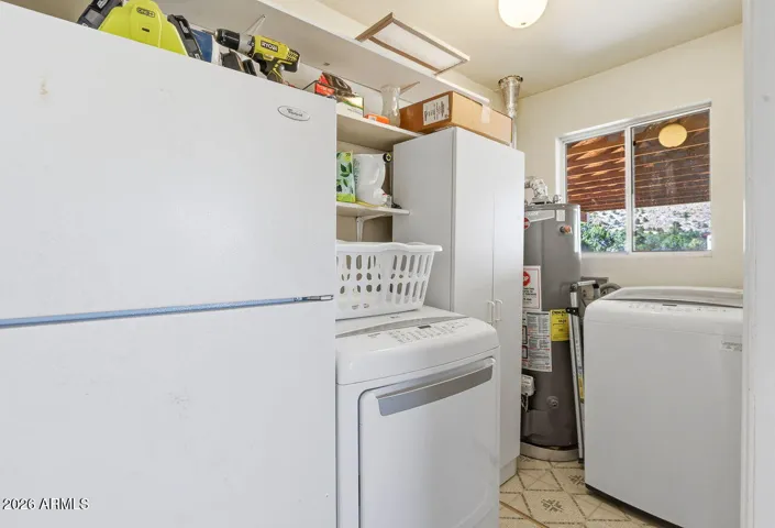 Laundry and utility room with washer, dryer and storage. Functional space in Hackberry Arizona home.
