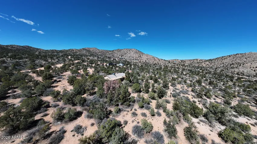 Beautiful native Junipers and desert pines dot the landscape. A vibrant ecosystem that provides natural screening and local wildlife habitat.