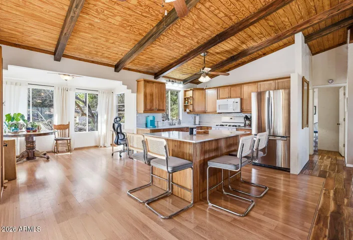 Large kitchen island with seating and stainless appliances. Great gathering space in this Hackberry AZ home near Kingman.
