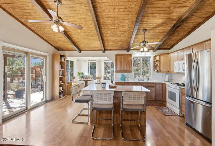 Open kitchen with large island seating and natural light. Ideal layout for entertaining in this Hackberry AZ home near Kingman.