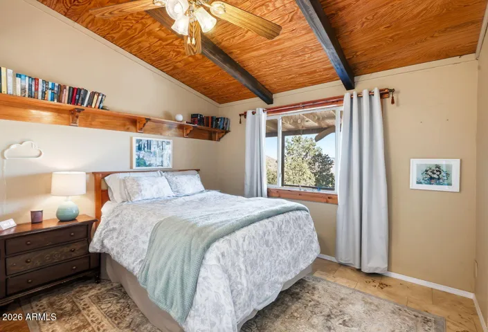Primary bedroom with vaulted wood ceiling and mountain views. Peaceful retreat in Hackberry AZ near Kingman and historic Route 66.