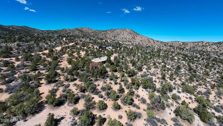 Peer across the vast valley floor from your elevated homesite. This property captures the sheer scale and beauty of the Arizona desert.