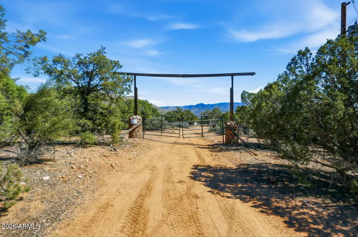 Private gated entrance to this Hackberry AZ property near Kingman with mountain views and scenic Mojave County desert terrain.