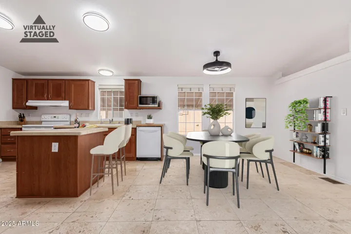 This virtual rendition of the dining and kitchen shows that there is room for chairs at the island as well as a dining table for more formal meals.
