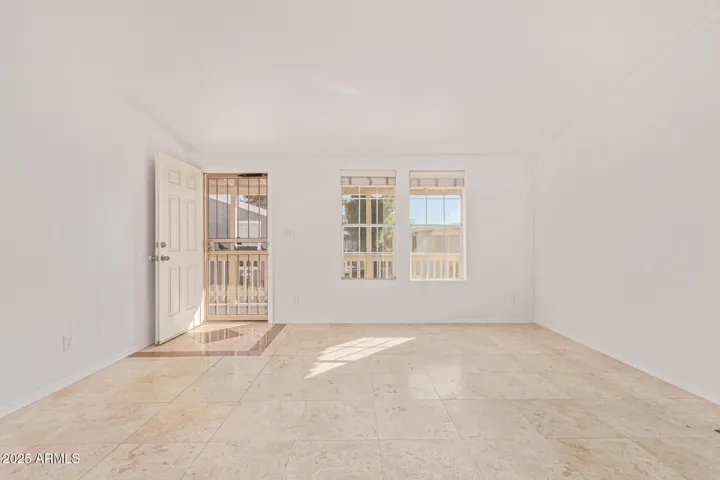 Custom stone mosaic frames the entrance. Great room with vaulted ceilings!