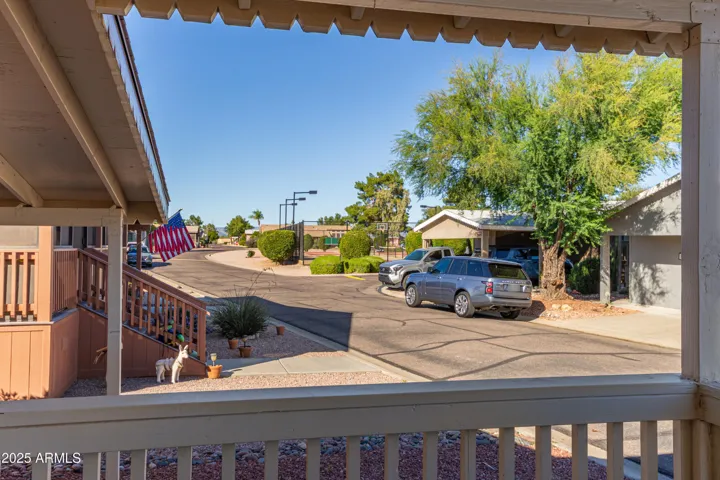 View of Pickle ball court from your front patio. Horse shoe pit, mail area, and clubhouse are steps away!