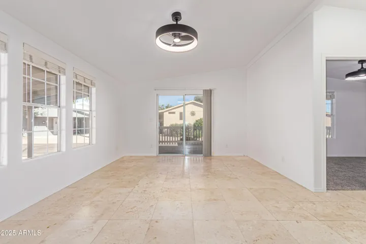 FACING FRONT PATIO. Bright and inviting, living area 1 offers a view (and access to) the front patio!