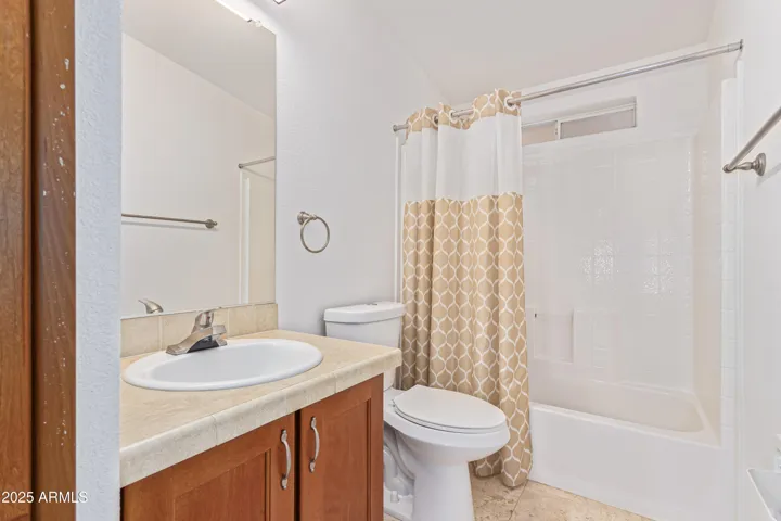 UPGRADED Raised vanity and seamless tub and surround shower.
