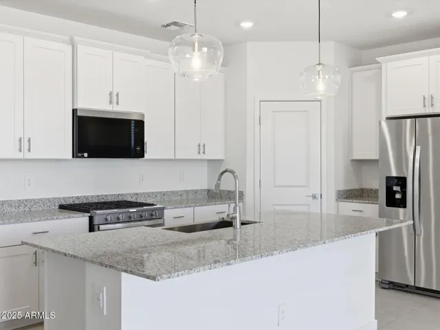 Photo is not of the actual home. Interior finishes and fixtures may vary