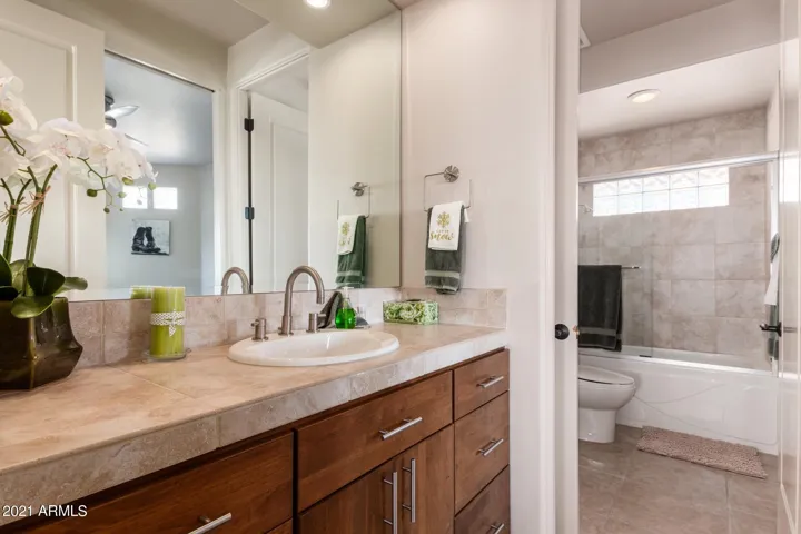 TWO SEPARATE VANITY AREAS FOR EACH BEDROOM, SHARE ONE TUB/SOWER AND COMMODE.