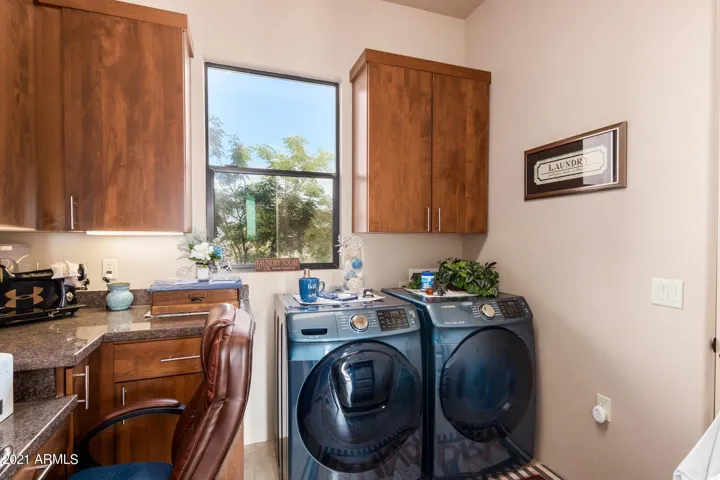 THIS ROOM COMES OFF THE HALL AND IS SET UP FOR SECOND LAUNDRY, DOOR TO MASTER CLOSET.