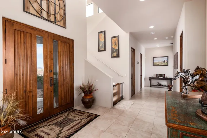 JUST INSIDE THE FRONT DOOR