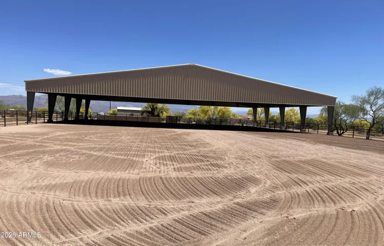 Granite Mt Ranch features 15 acres dedicated to Equestrian. The rectangle arena is now mostly covered and new footings added.