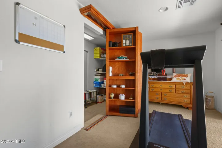"Secret" entrance to closet hidden behind bookcase.