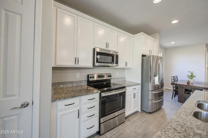 Beautifully upgraded white cabinets with modern hardware.