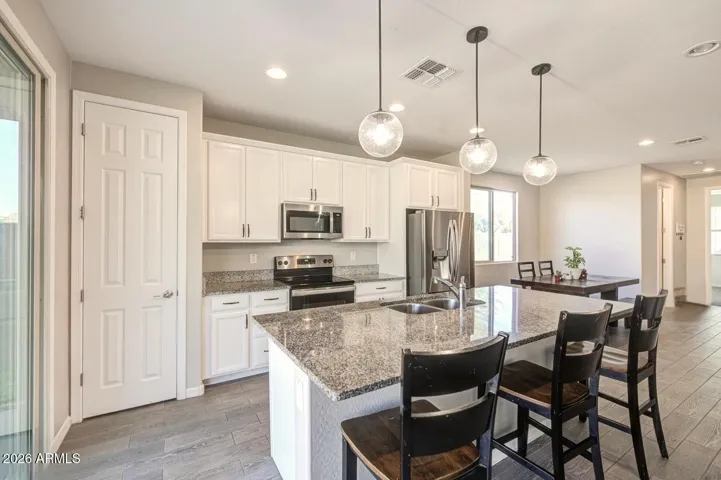 Kitchen showcasing the breakfast bar center island.
