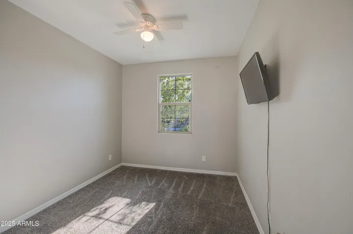 Downstairs bedroom can be used for overnight guests or home office.