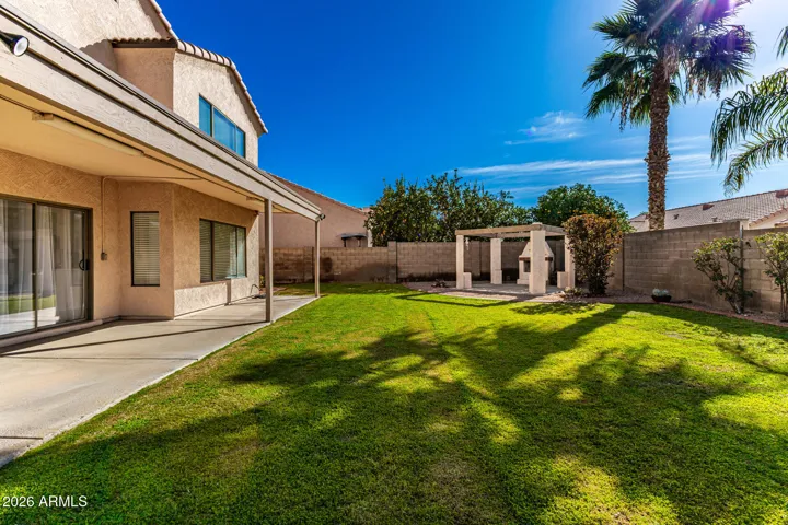 The backyard boasts different spaces for entertainment, zen, sports, leisure, and space to add a pool!