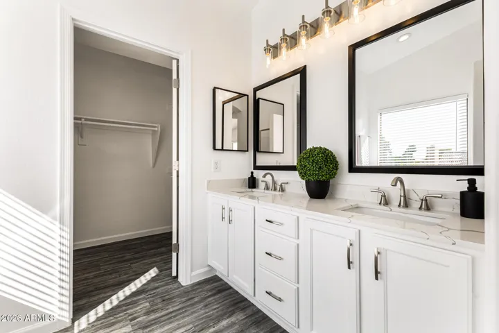 No need to share a mirror in this master bathroom. Plenty of space for two!