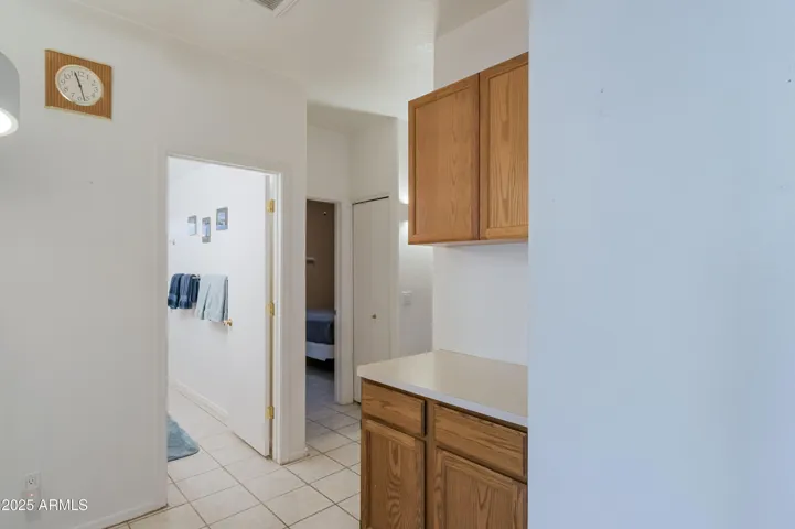 Hall to bedrooms, laundry room, and garage