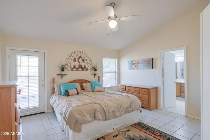 Primary Bedroom w/ door to backyard