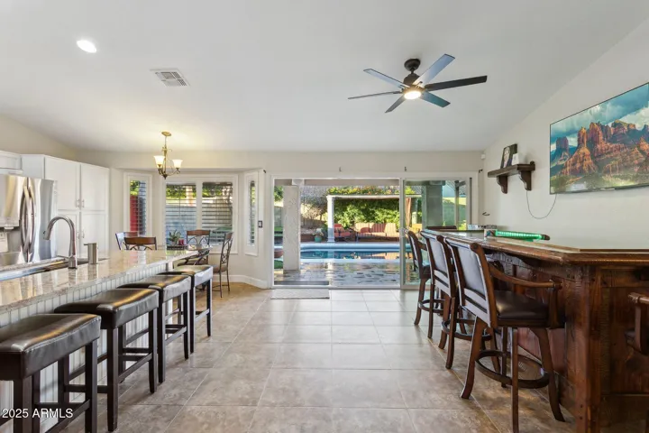 Kitchen/Custom made bar by the years award winning woodworker, and view out of 15' retractable sliders