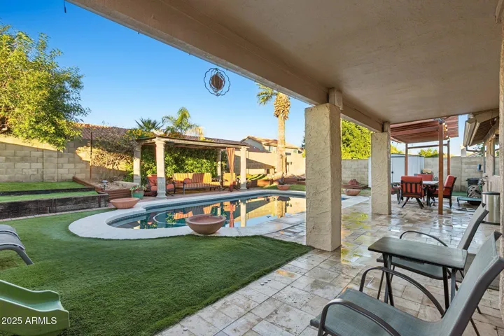 Covered patio with travertine tile