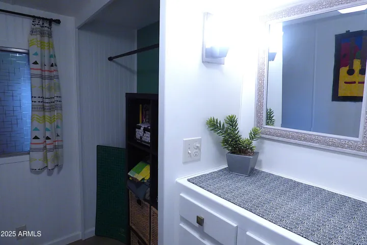 Hobby room has a small closet area for hanging or storing items and has a built-in dresser for storing all your supplies.