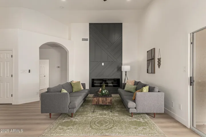 Great room with custom wall and electric fireplace