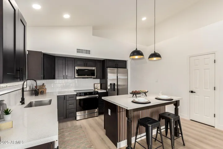 All new quartz countertops, shaker cabinets, stainless steel appliances.