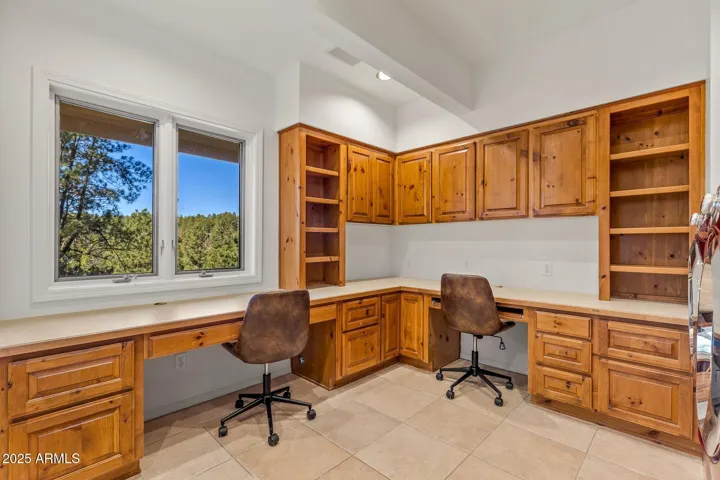 Large laundry room with ample storage and desk space