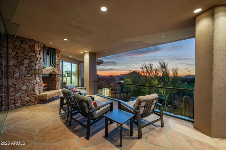 Cozy fireplace with mountain and golf course views