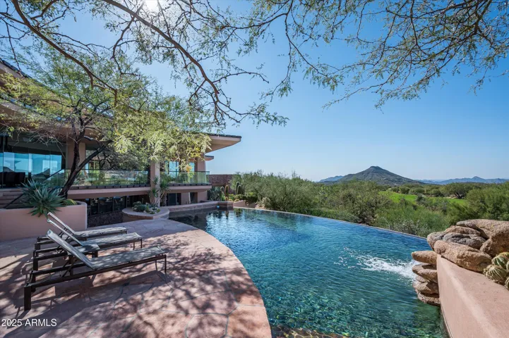 Pool with mountain and golf course views