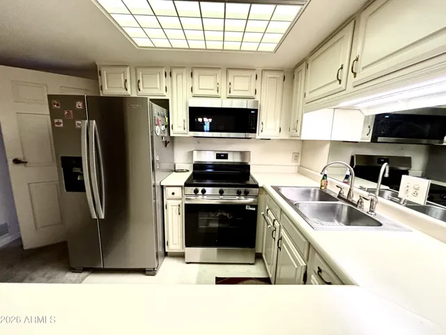 BRAND NEW STAINLESS STOVE, MICROWAVE AND DISHWASHER!
