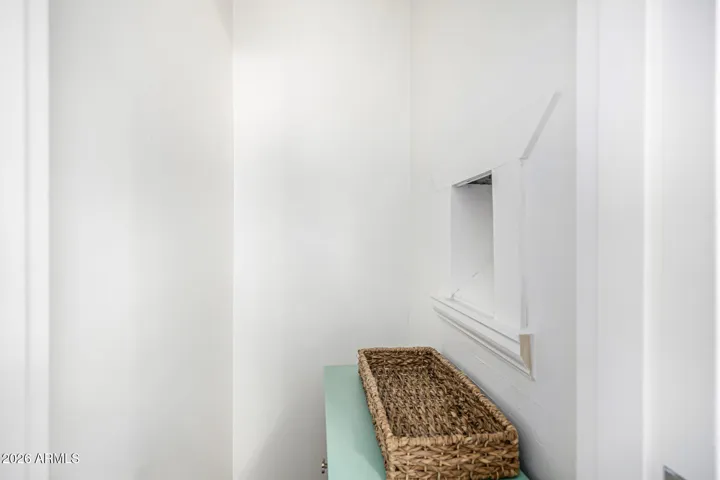 The old fashioned mail slot is still in use and drops mail right into this little basket that's tucked into one of two foyer closets!