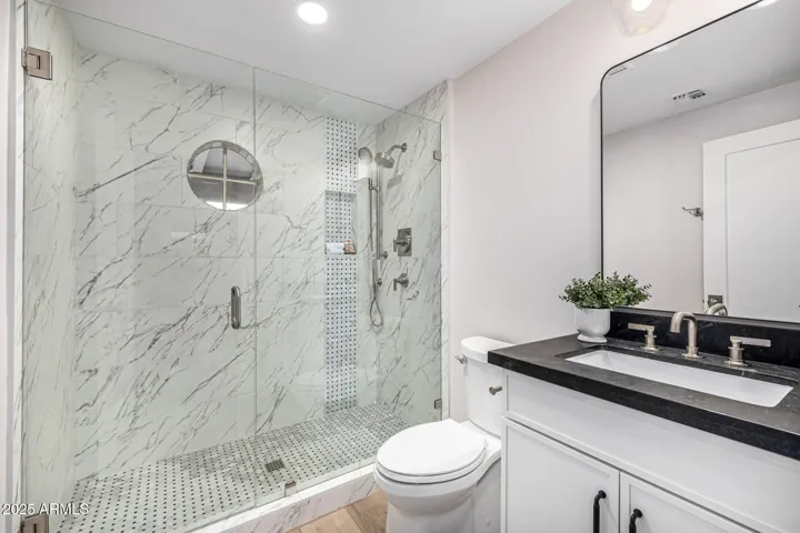 The casita features a full bath with vanity, toilet, and step-in shower.