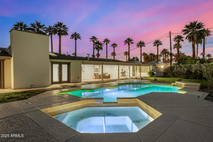 The backyard is stunning with a pool and spa, extended covered patio, storage shed, herb garden, and BBQ terrace with gas firepit.