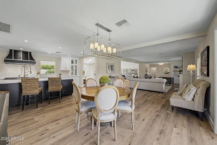 A view from the dining room to the kitchen and sitting room shows how open and spacious this home truly is.