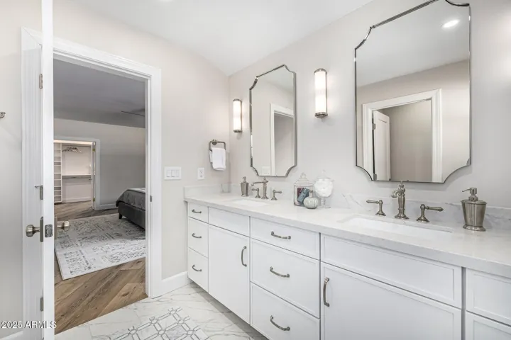 The primary en suite features a double vanity, water closet, and step-in shower.