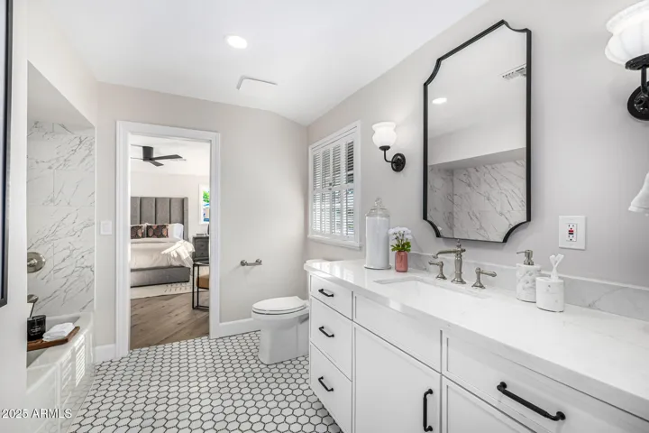The secondary bedrooms are joined by a jack & jill bathroom finished in classic black & white marble.