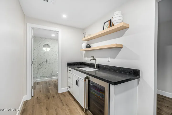Whether you use the casita as a home office, gym, or guest suite, you'll love the kitchenette with sink and bev fridge!
