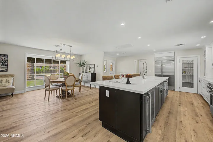 The island kitchen is open to the dining room for a more modern feel.