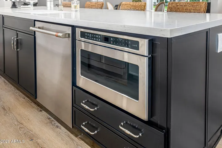 We didn't forget the microwave! Discretely placed in the kitchen island for easy access.