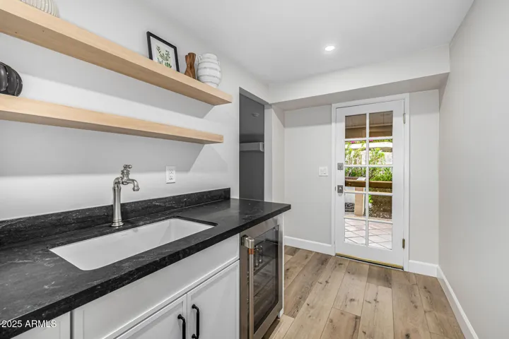 The casita has two entrances: one off the carport that enters the main room, and one off the back patio leading to the pool.