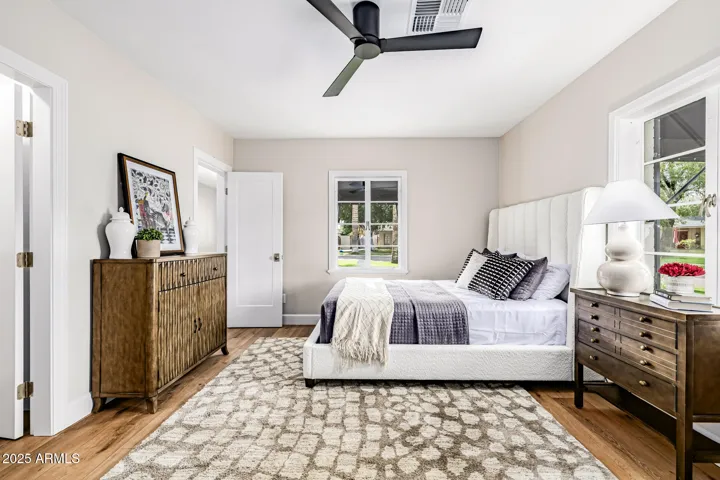 Both secondary bedrooms in the main house are larger than most. This bedroom at the front of the home features mullioned windows and a walk-in closet.